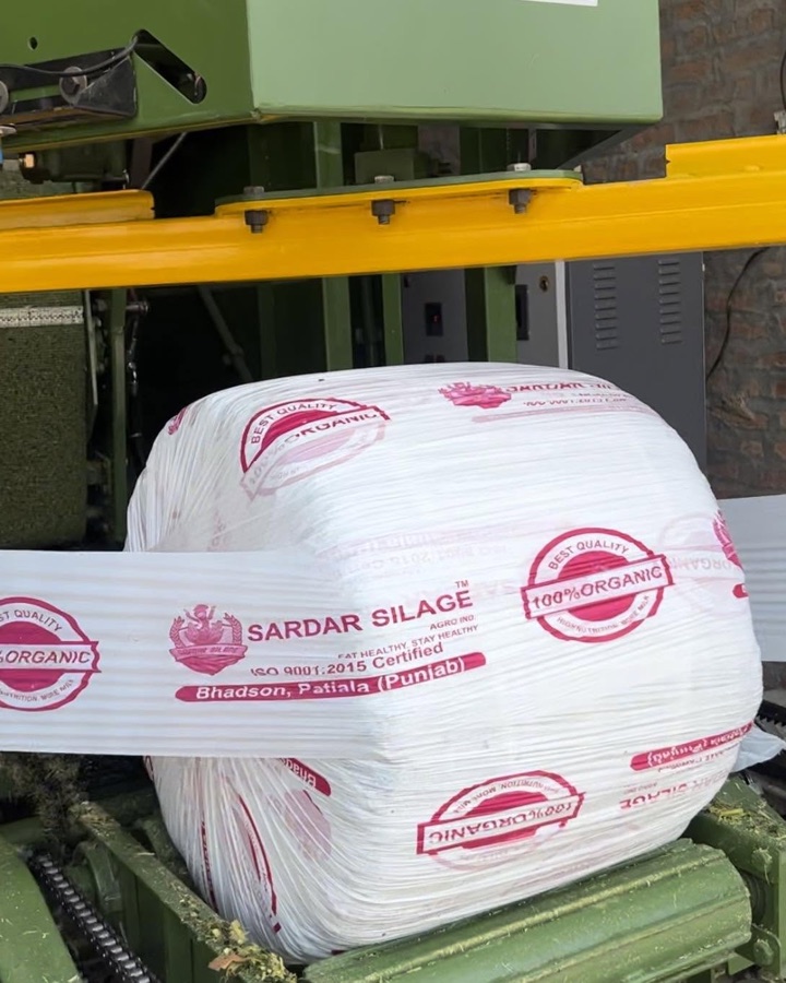 A bale being wrapped airtight on the machine
