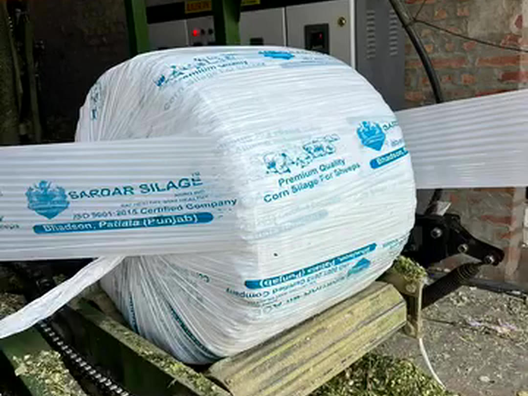 A fresh bale being wrapped on the machine
